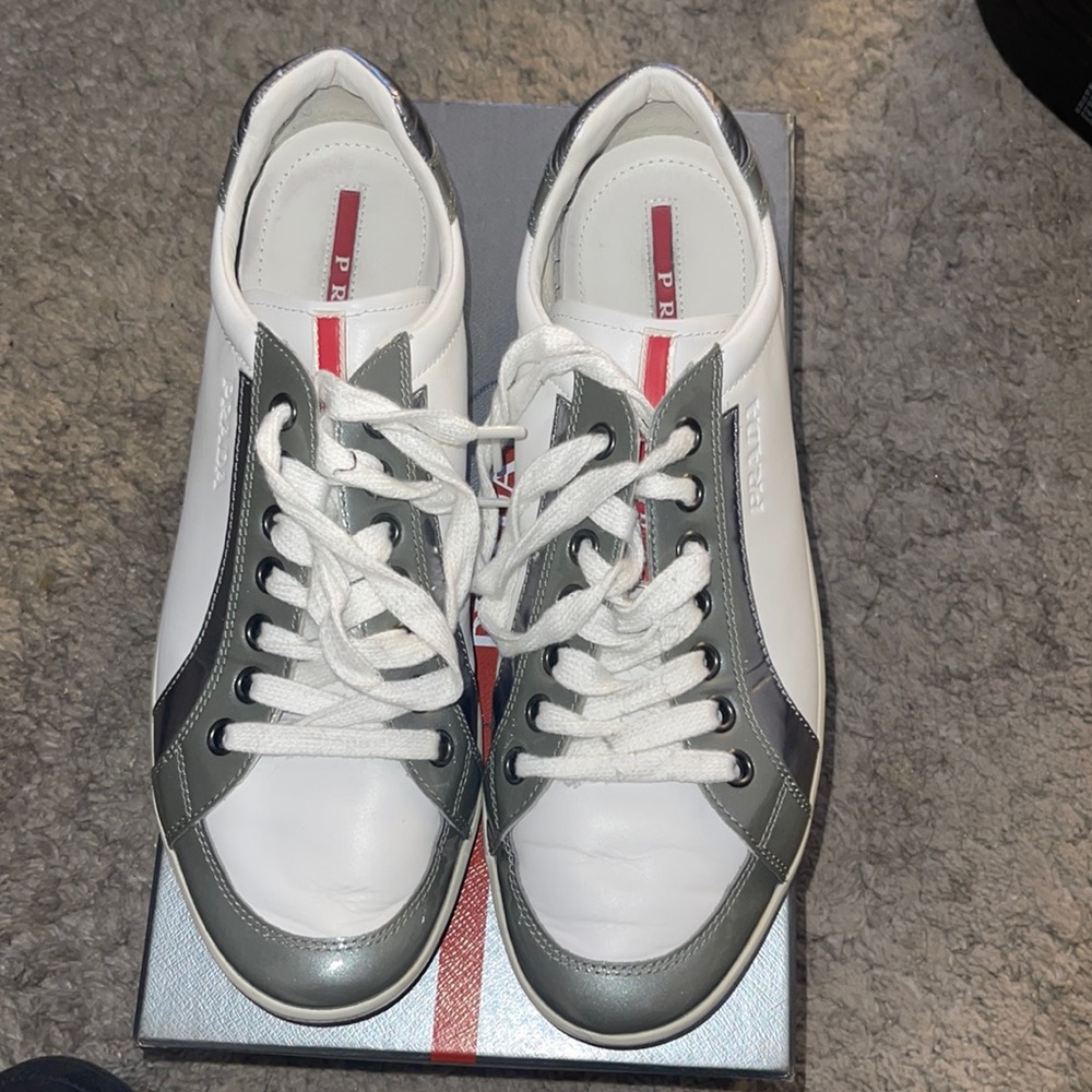 White Prada low top sneaker.